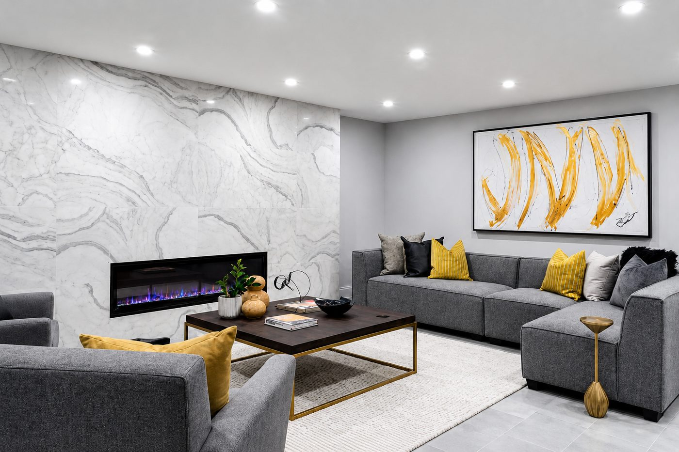 Finished basement lounge with fireplace and sectional in a Toronto home