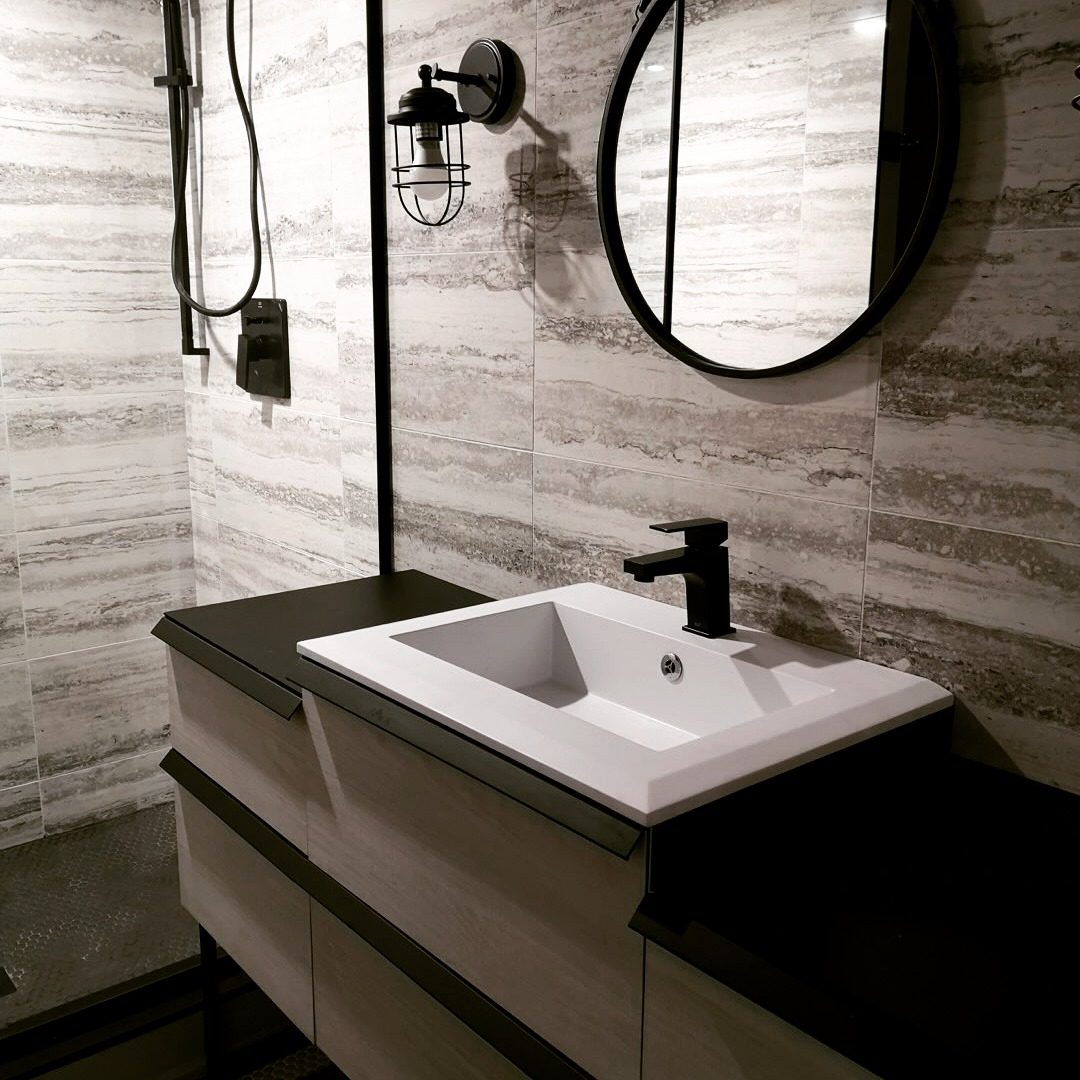 Modern basement bathroom with floating vanity in a Toronto basement finish
