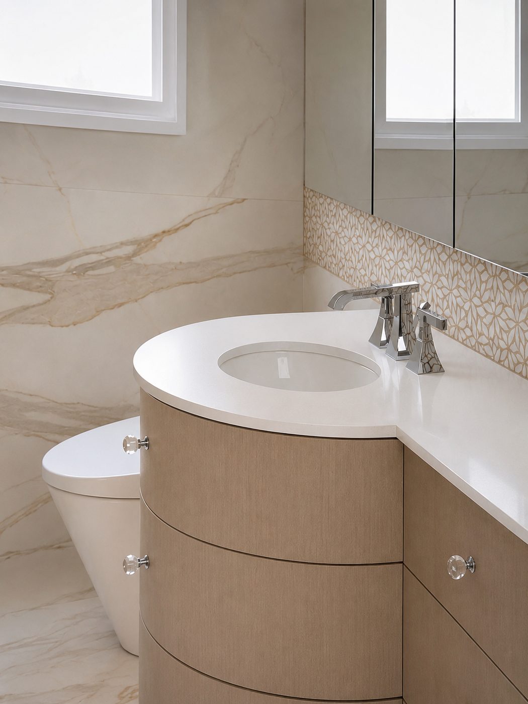 Custom curved vanity with marble in a high-end Toronto bathroom remodel