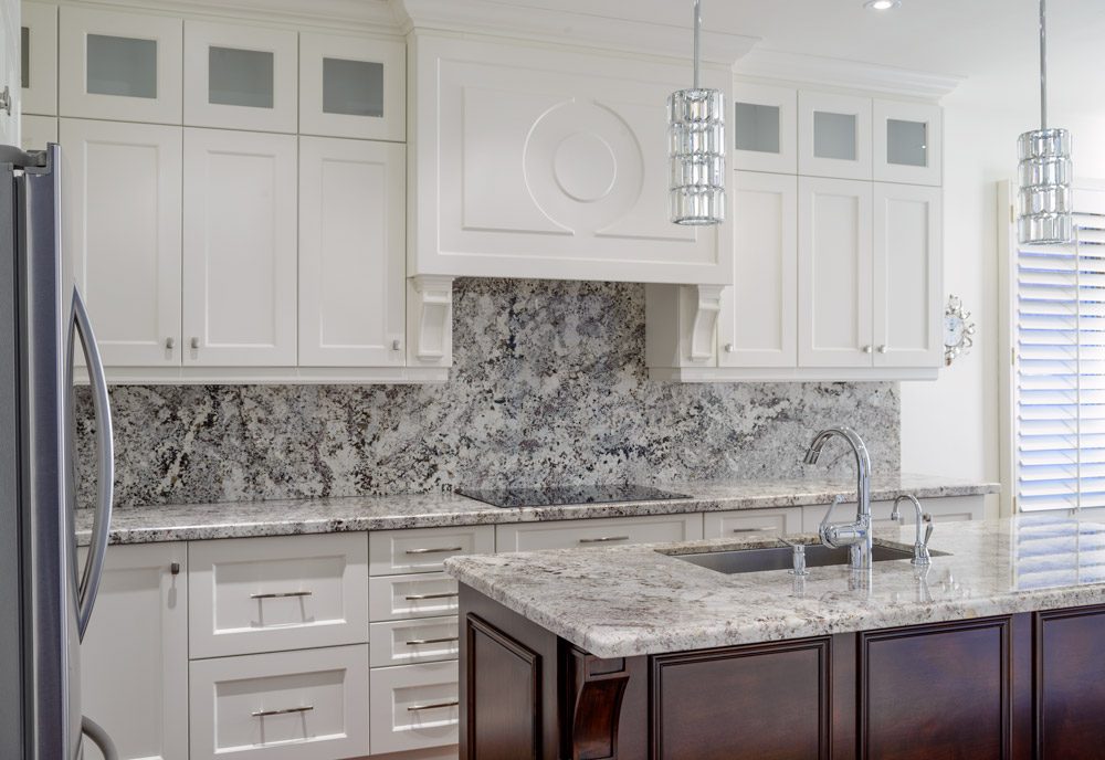 Custom kitchen with granite counters and backsplash in Richmond Hill