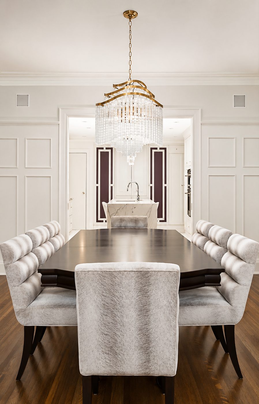 Luxury kitchen with waterfall island and dining seating in Toronto